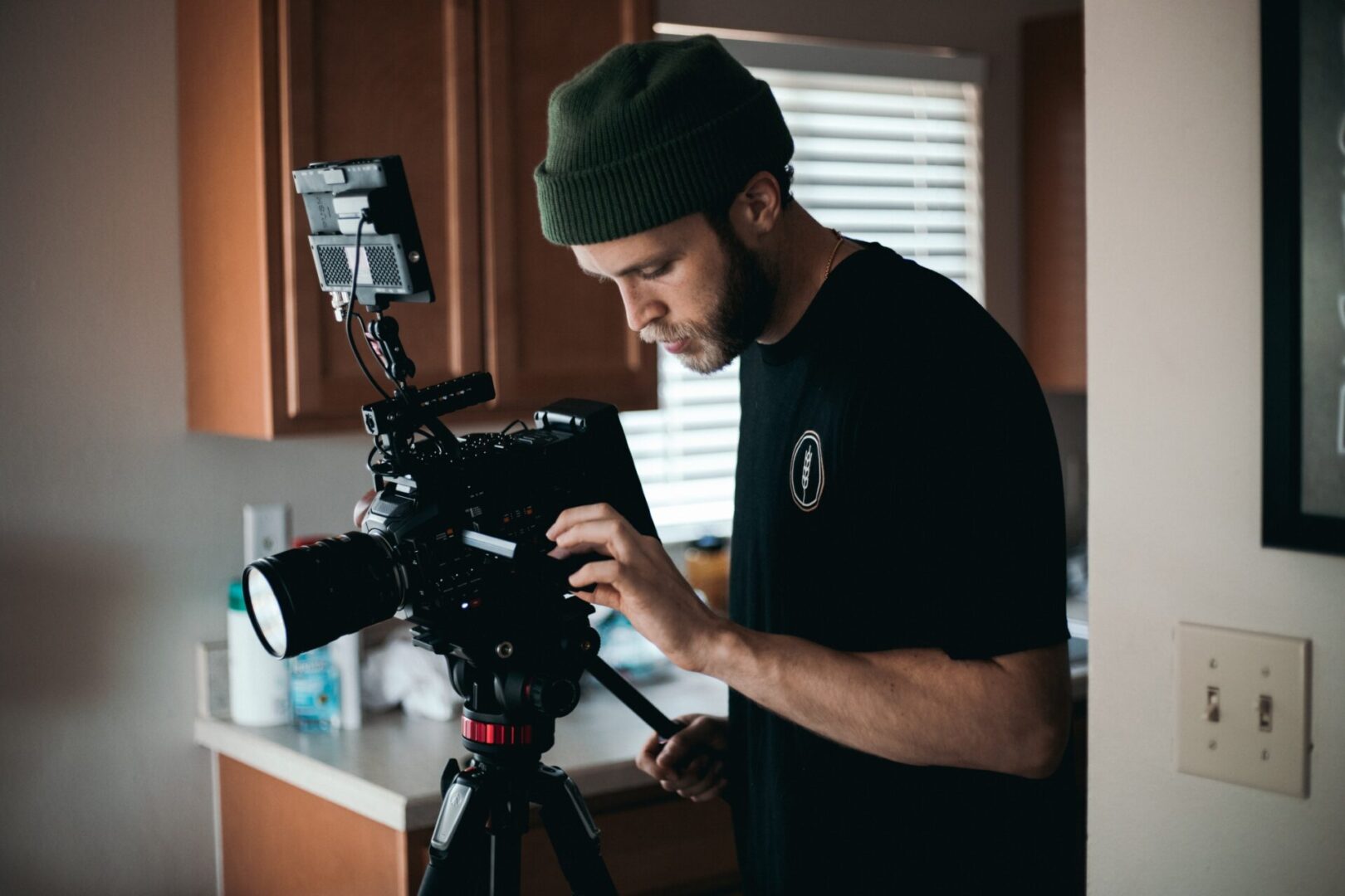 Professional videographer holding professional camera